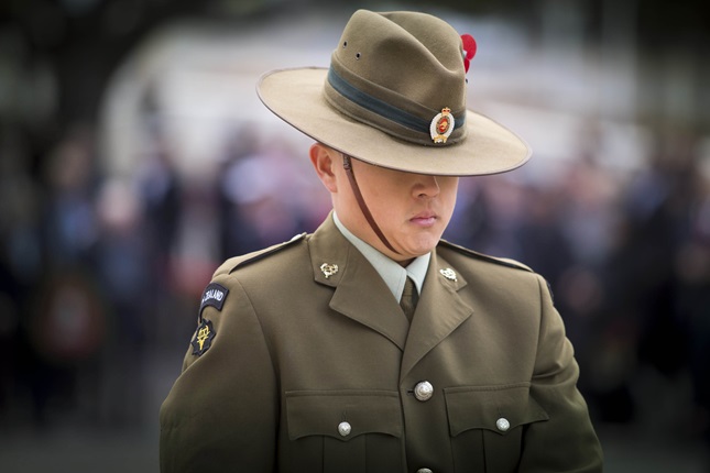 Close up of soldier in uniform with hat tilted down at Anzac Day Wreath Laying Ceremony at the Wellington Cenotaph