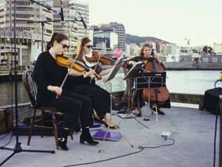 A string trio perform on Valentine's Day.